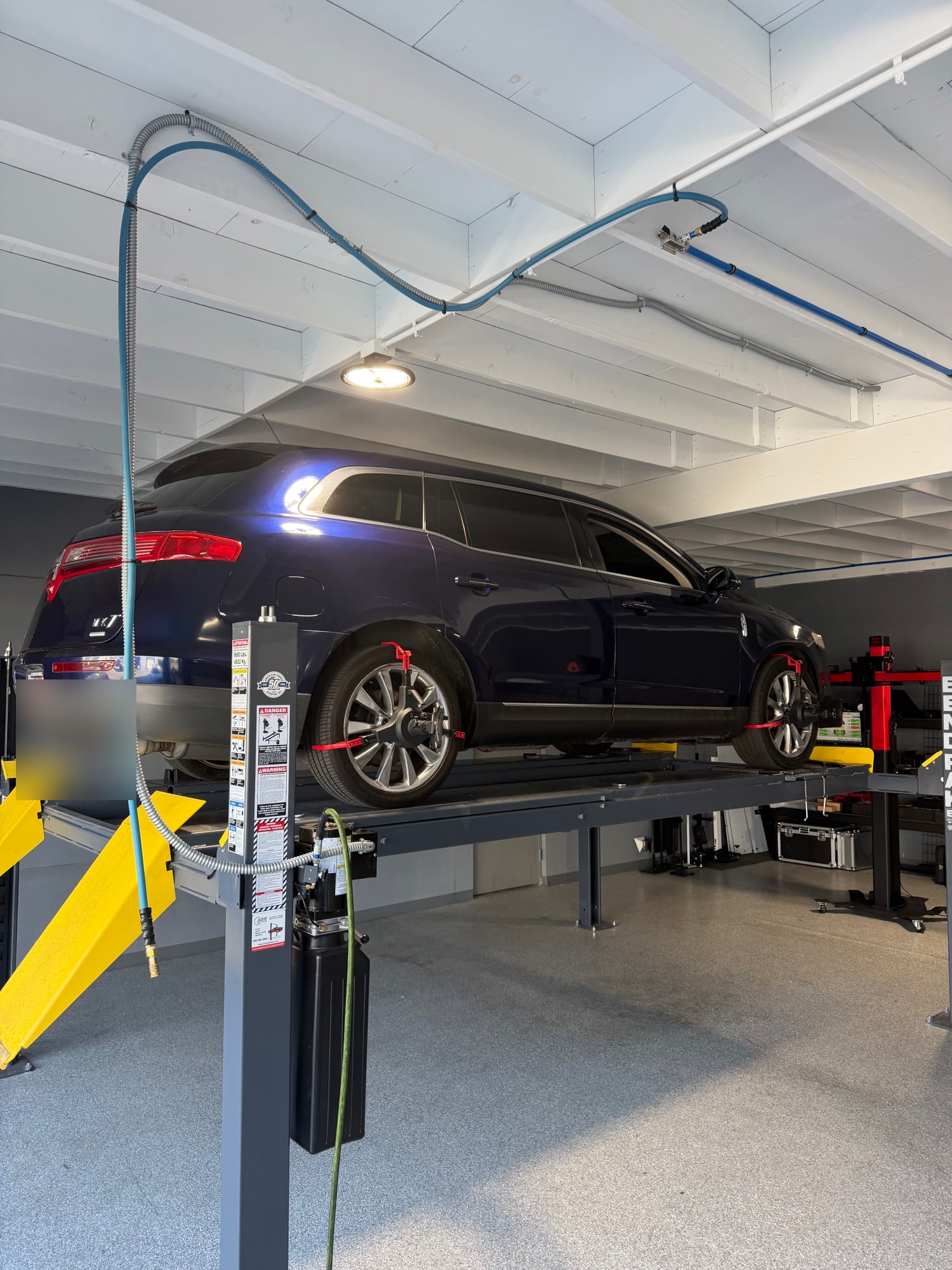 Vehicle positioned on Calibri Motorsport wheel-alignment equipment