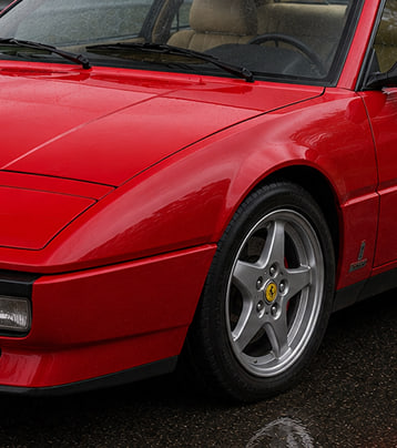 Red Ferrari front-left exterior in the supplied after-work photograph