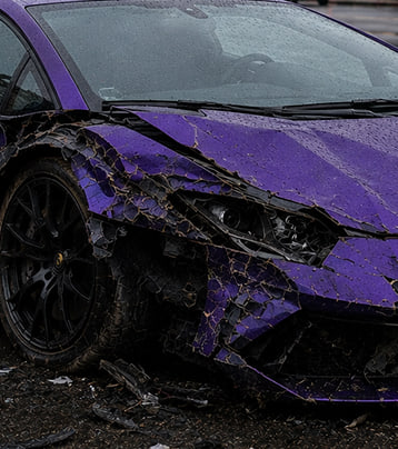 Lamborghini with visible front-left collision damage in a supplied before photograph