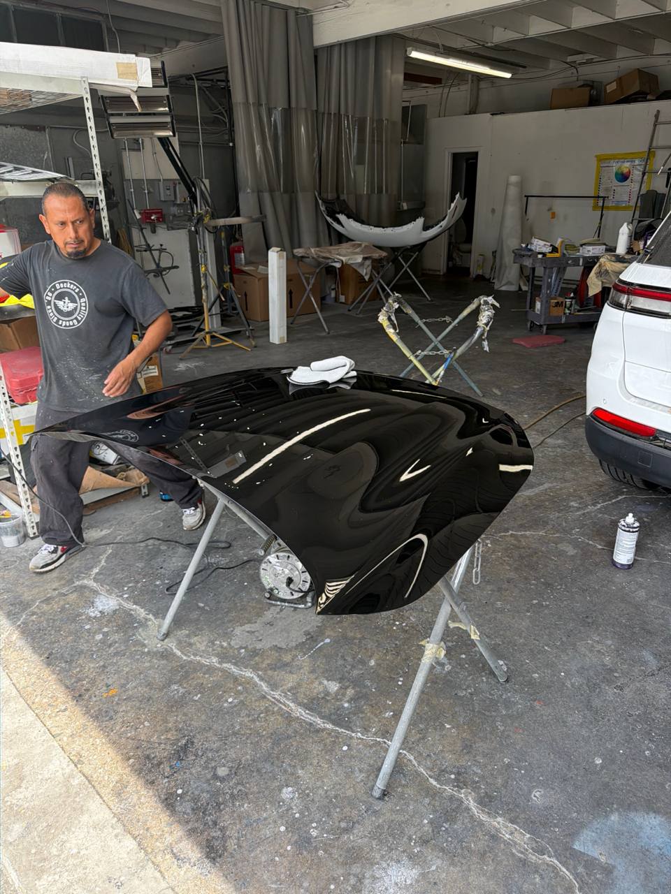 Approved Calibri Motorsport shop photograph documenting Jeep and BMW refinishing work