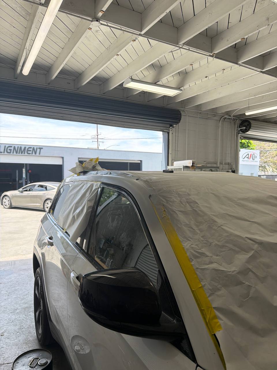 Jeep and BMW body and paint work documented inside Calibri Motorsport