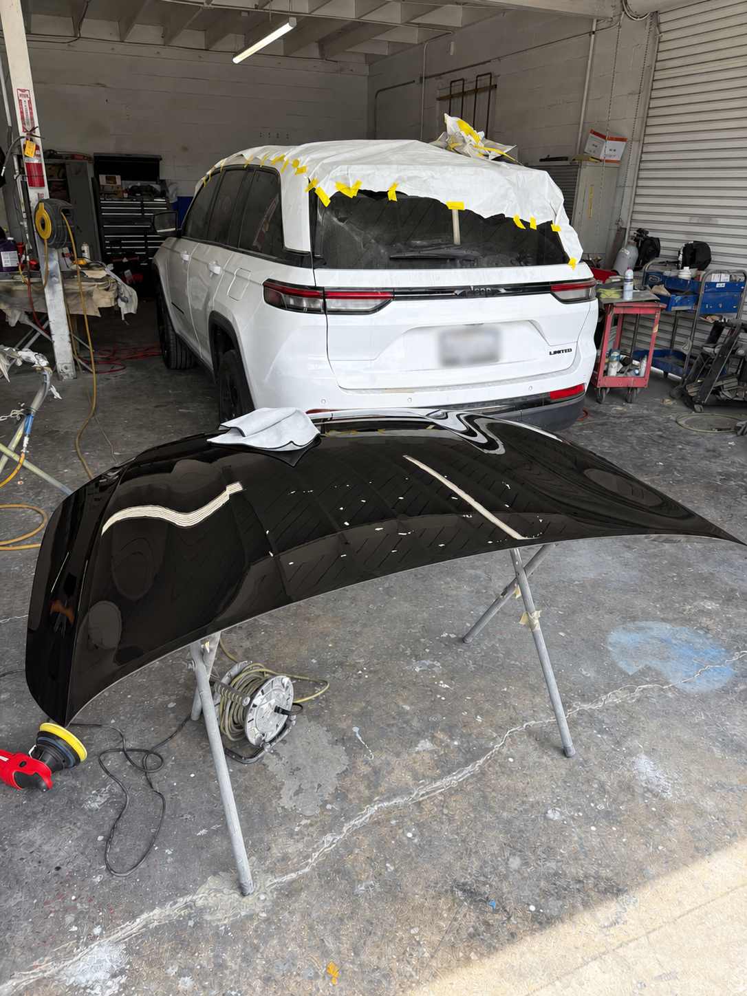 2022 Jeep Grand Cherokee masked and primed for refinishing at Calibri Motorsport in Hawthorne