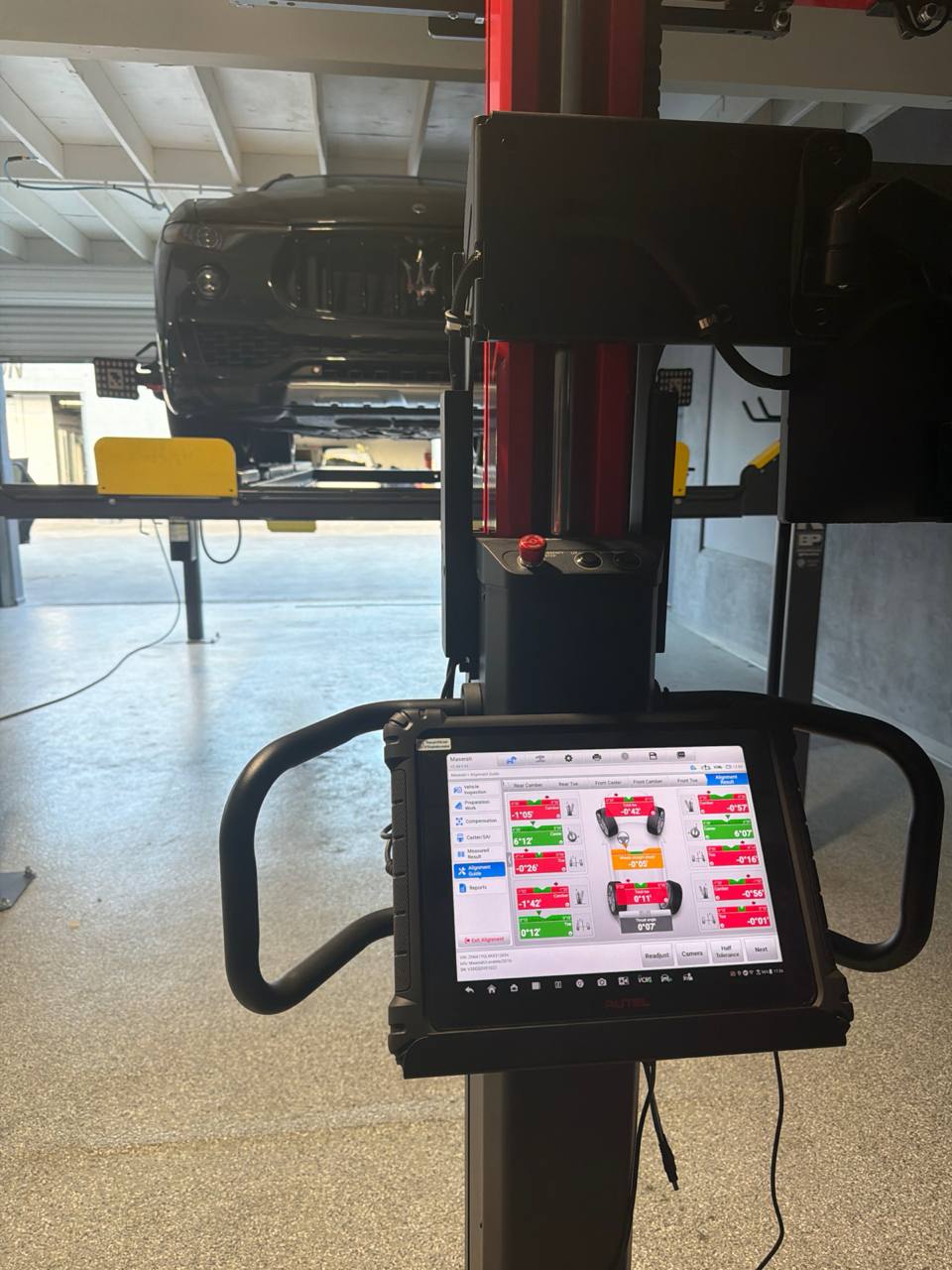 Maserati Levante positioned for post-repair wheel alignment and ADAS calibration
