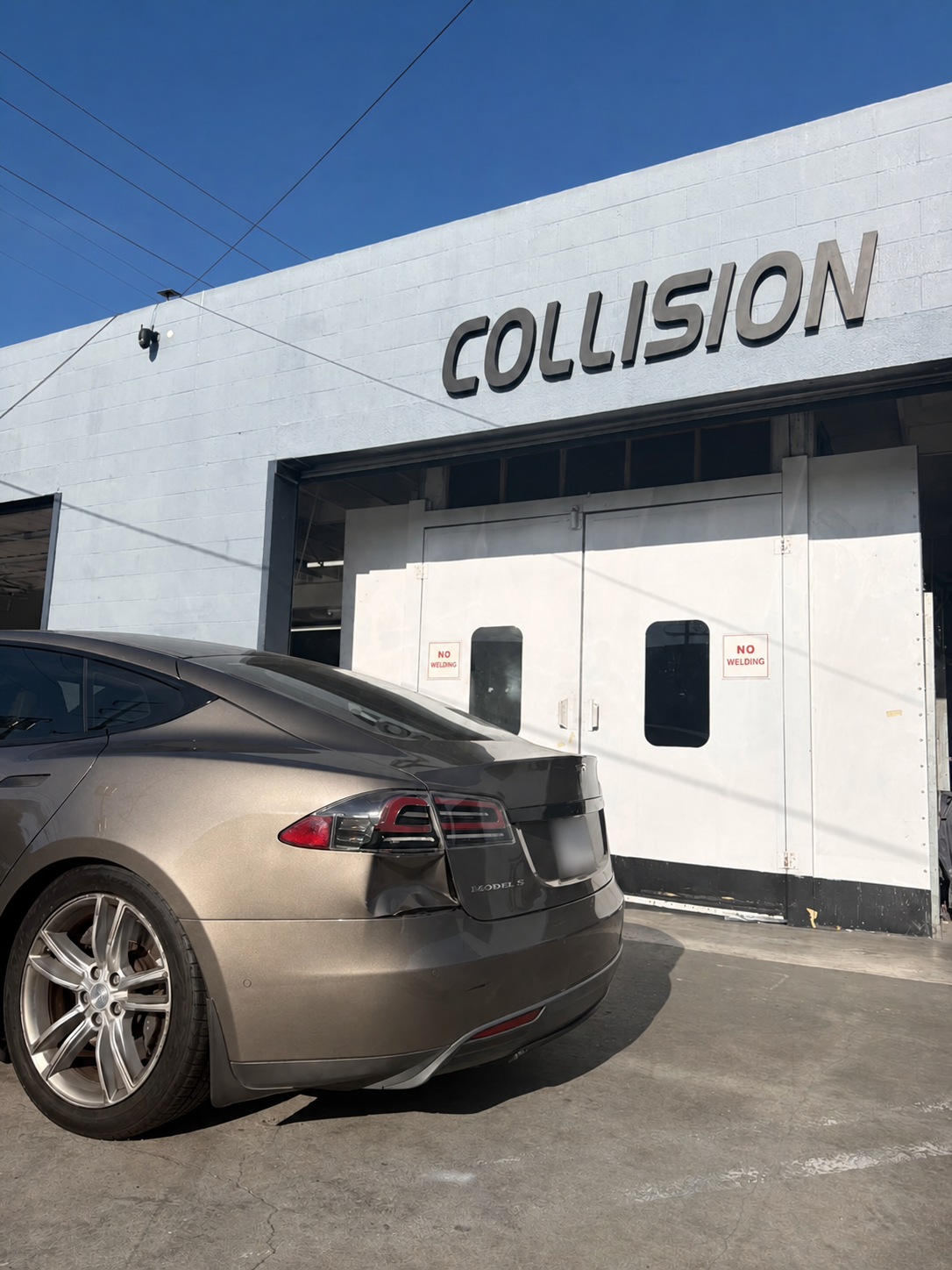 Tesla Model S arriving at Calibri Motorsport for collision damage and system assessment