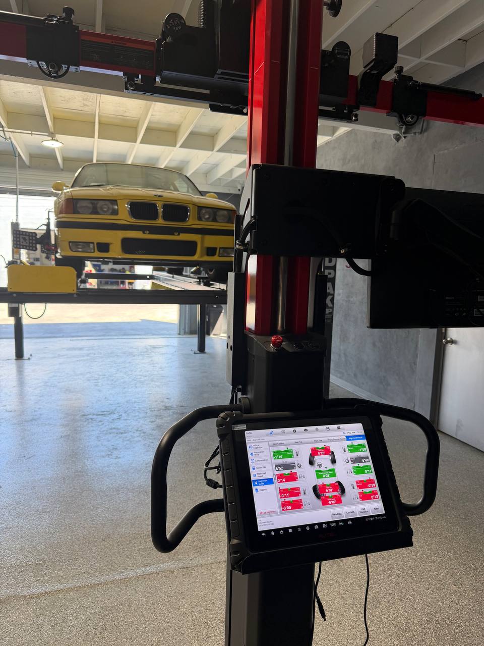 BMW E36 M3 and alignment measurement display inside Calibri Motorsport