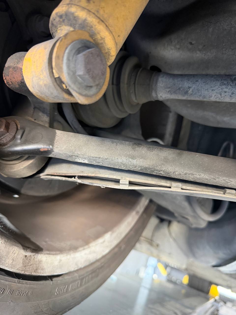 Close view of the rear axle and suspension area on a BMW E36 M3