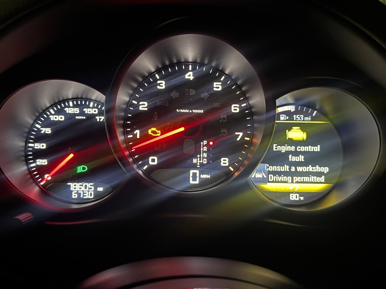 Porsche Macan instrument cluster displaying an engine control fault warning