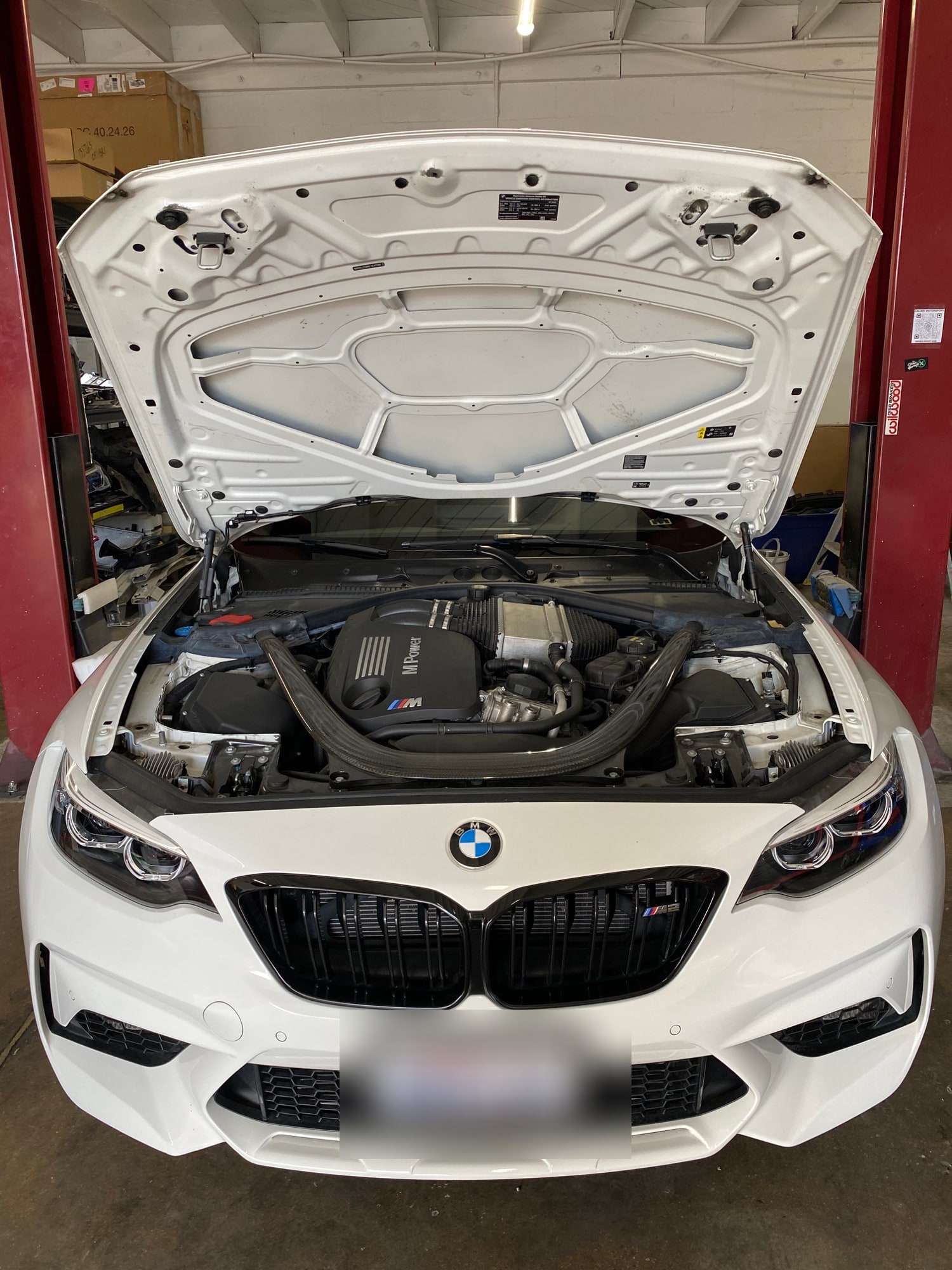 BMW engine compartment photographed during service at Calibri Motorsport
