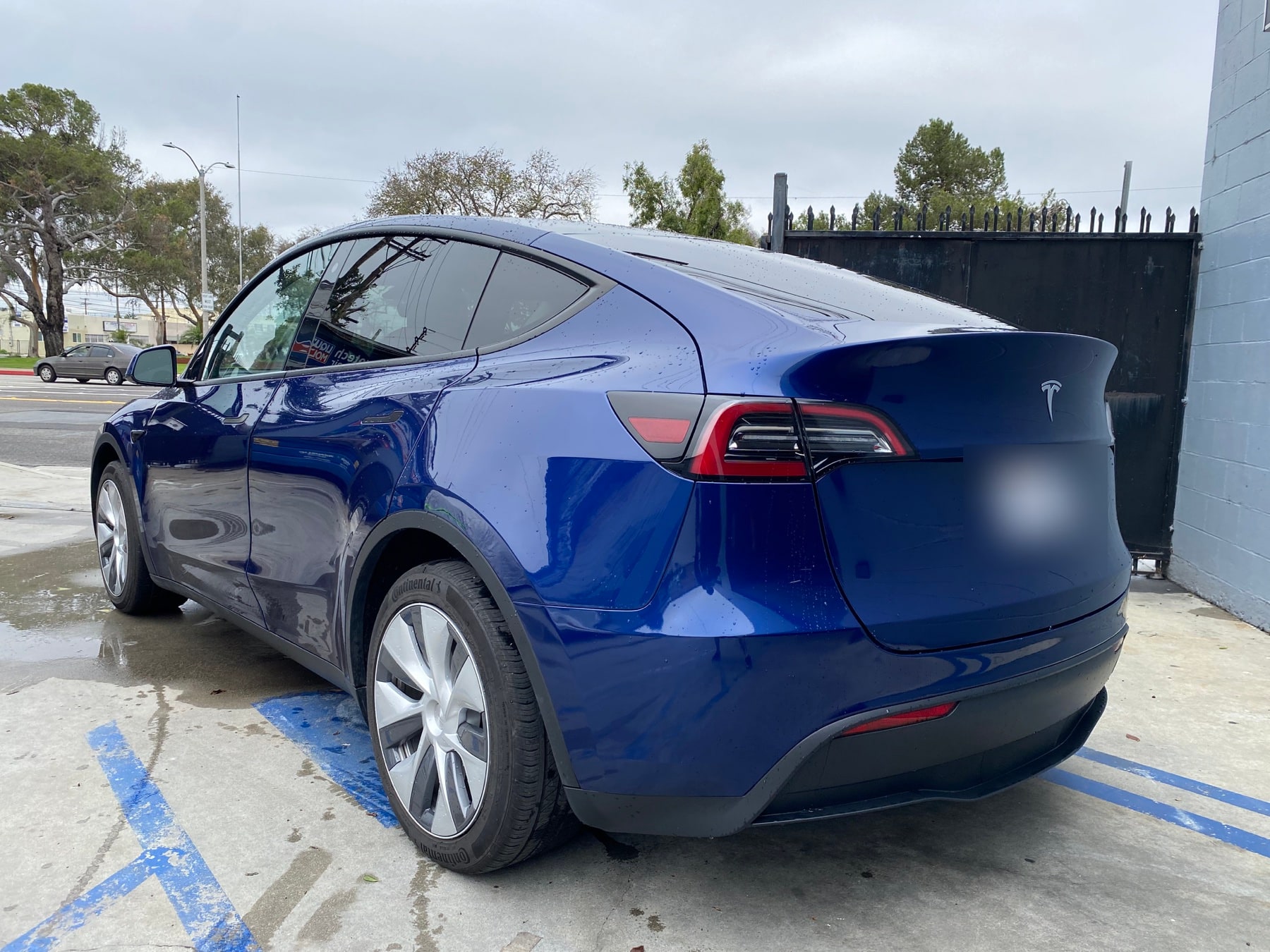 Blue Tesla Model Y photographed after body repair