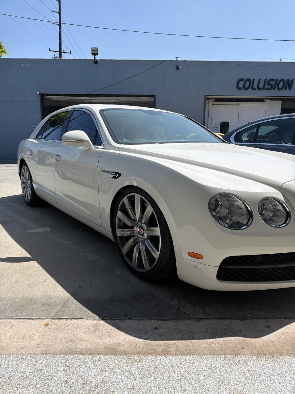 White Bentley sedan at Calibri Motorsport for air-suspension diagnosis