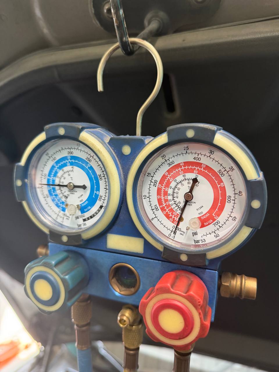 Air-conditioning service gauges used during Tesla Model S refrigerant work