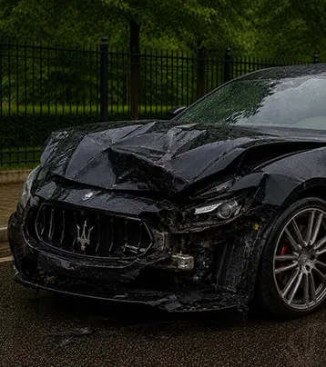 Maserati with visible front collision damage in a supplied before photograph