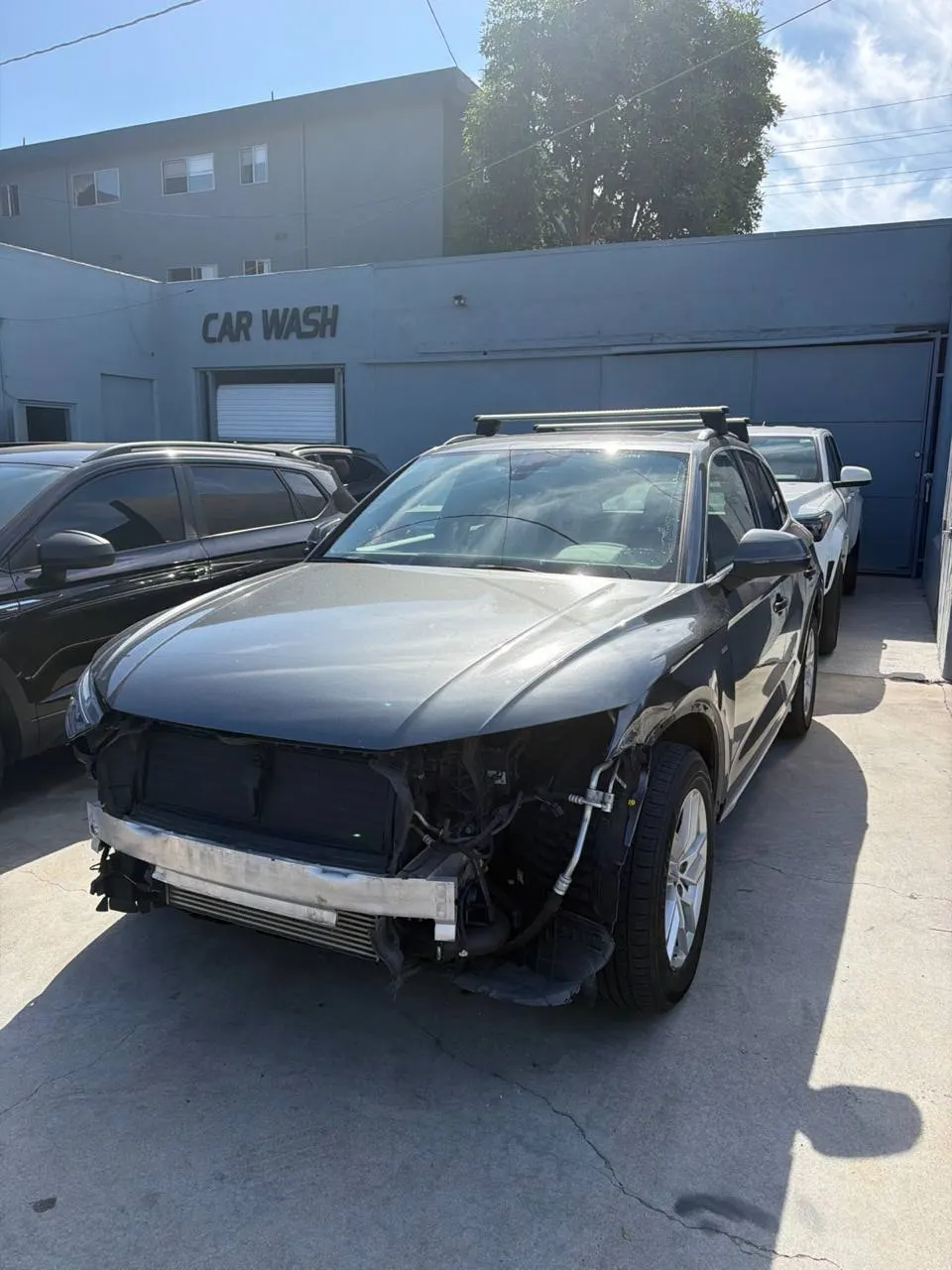 Front view of a damaged Audi Q5 with the bumper assembly removed