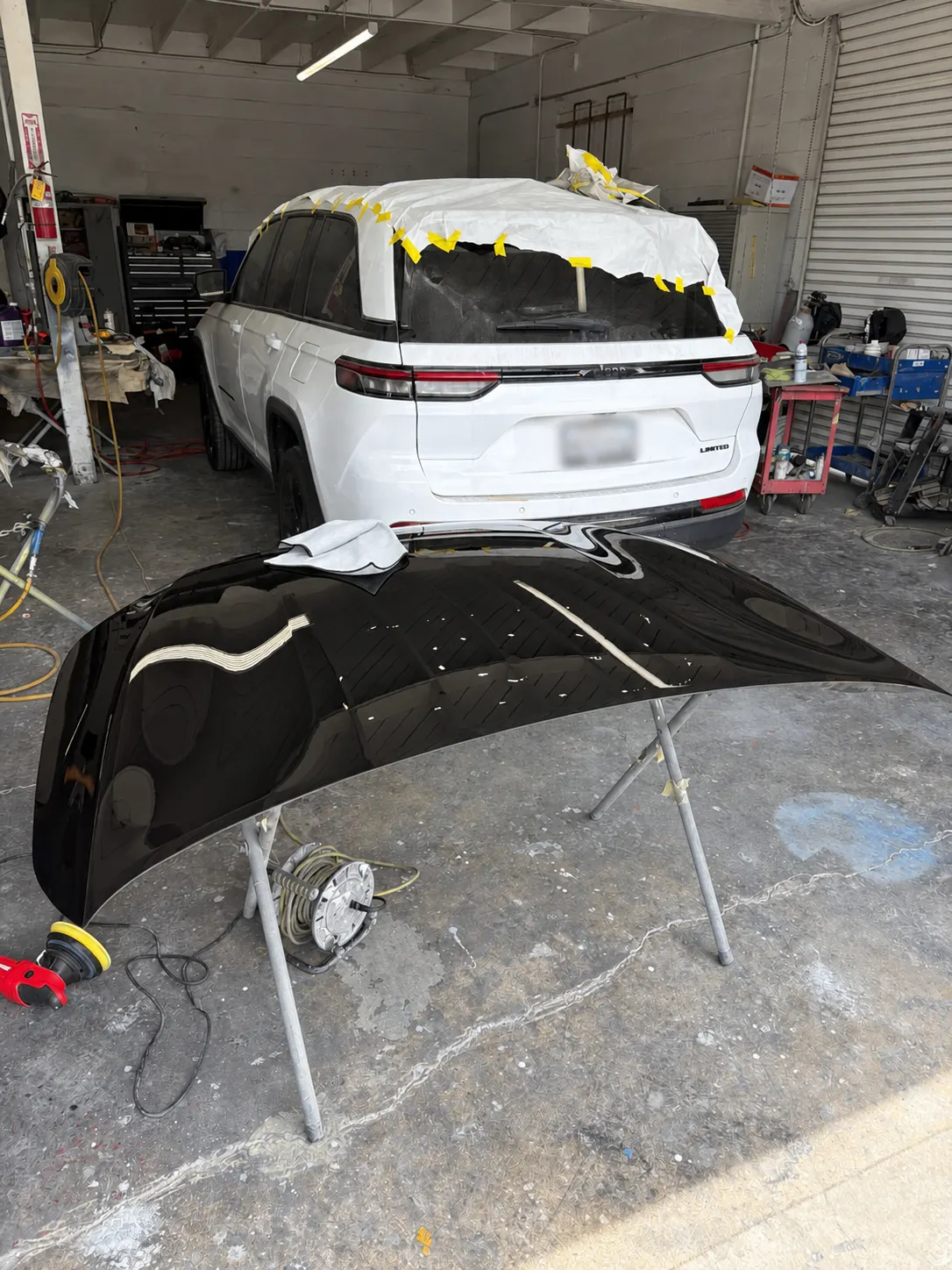 2022 Jeep Grand Cherokee masked and primed for refinishing at Calibri Motorsport in Hawthorne