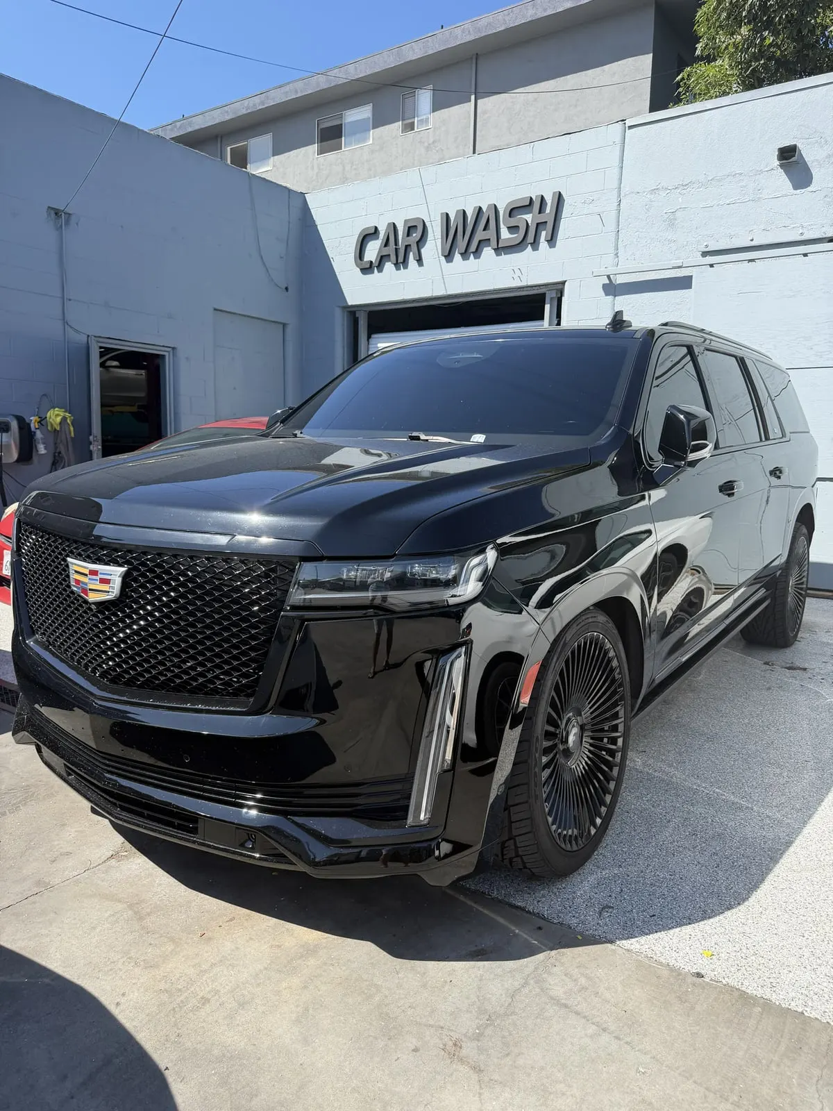 Cadillac Escalade outside the Calibri Motorsport car wash entrance