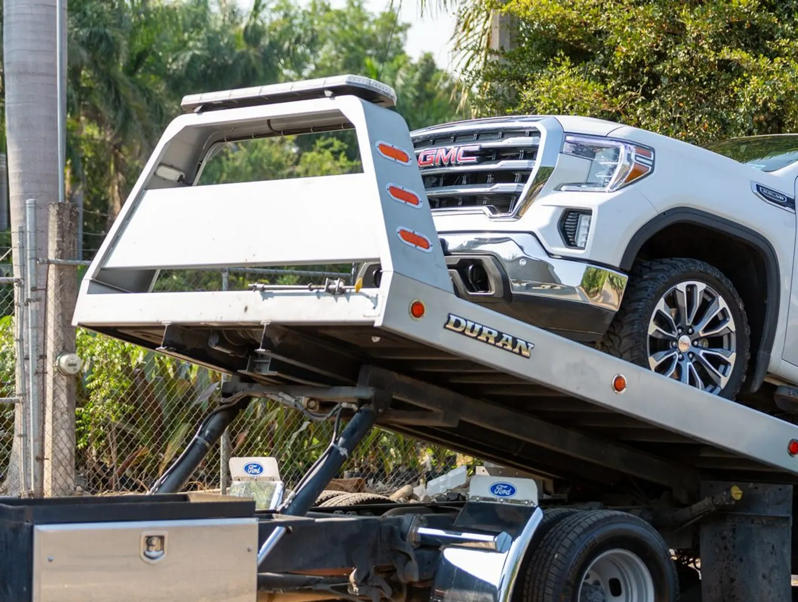 Flatbed tow truck prepared for vehicle transport