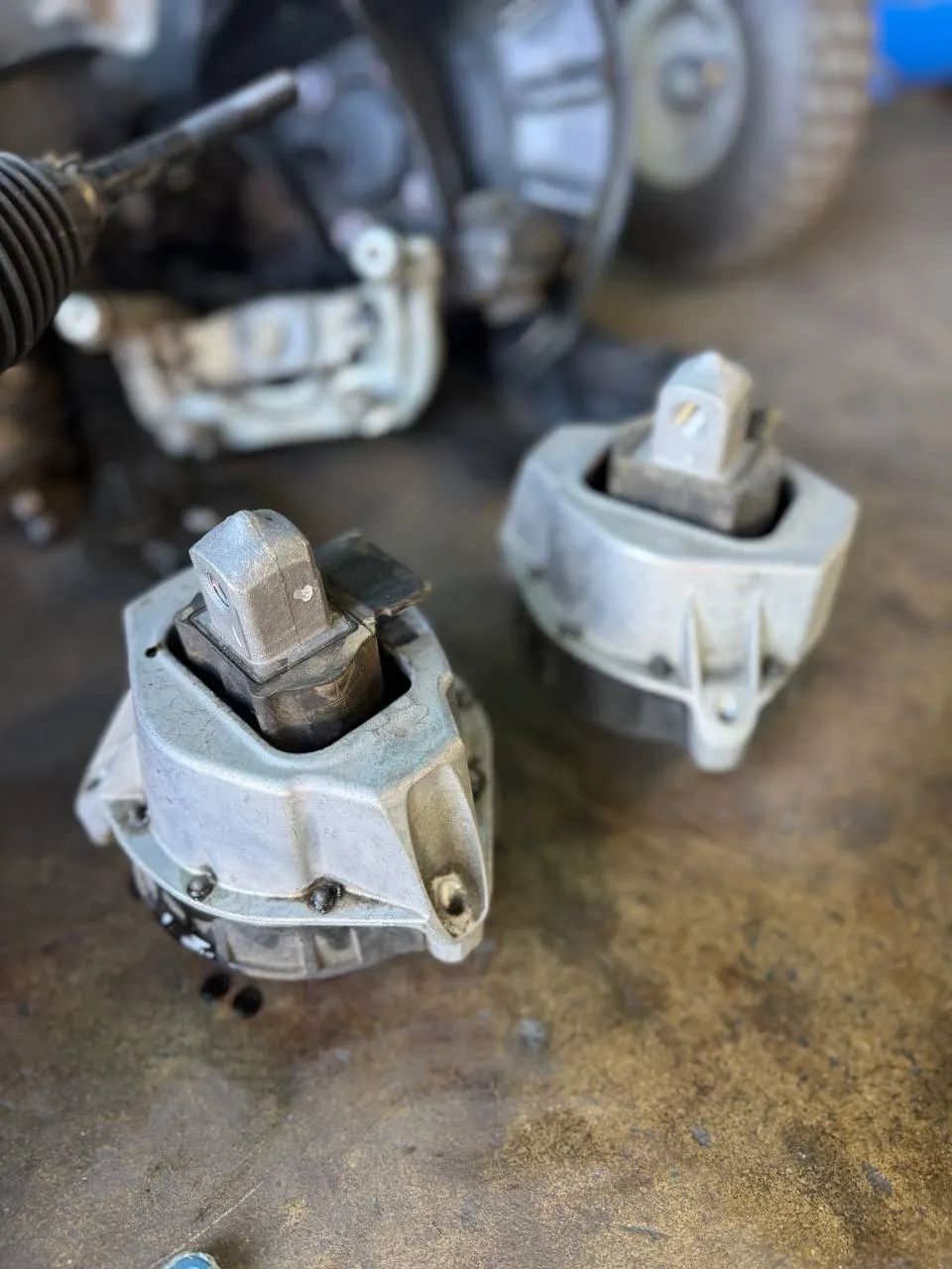 Two engine-mount assemblies side by side on a workbench