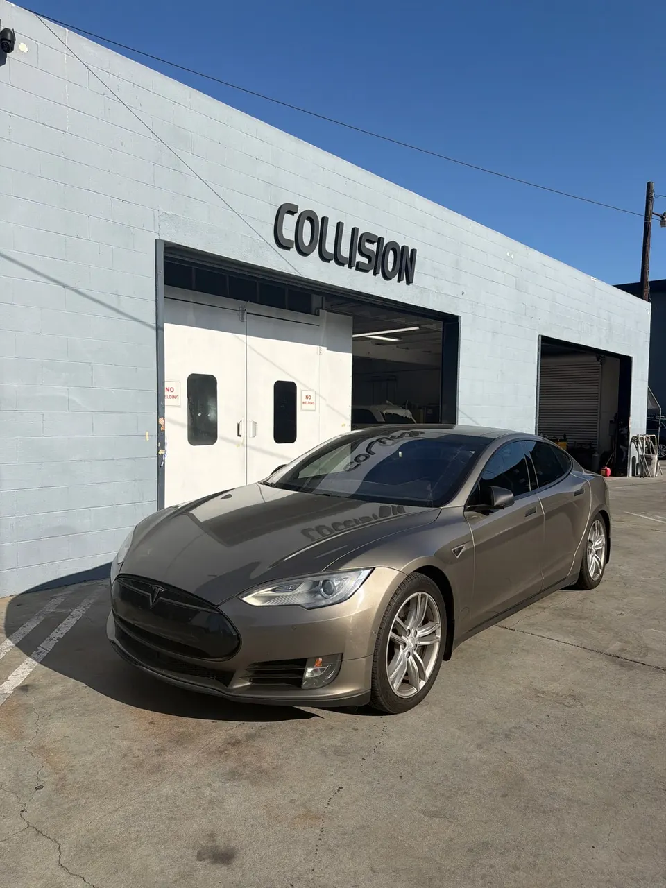 Tesla Model S outside the Calibri Motorsport collision entrance