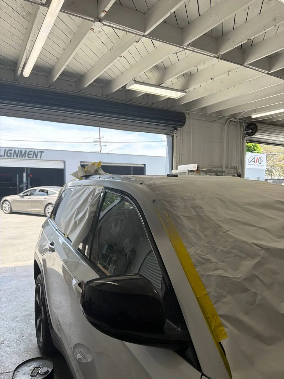 Masked windshield and adjacent bodywork on a Jeep Grand Cherokee inside Calibri Motorsport